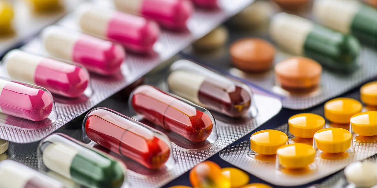 Medication with capsule pills and rounded tablets